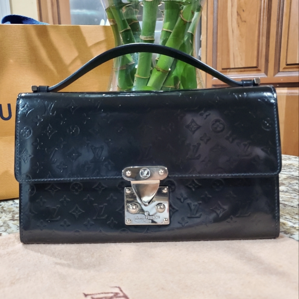 Pre-love own  Louis Vuitton pochette handbag.
